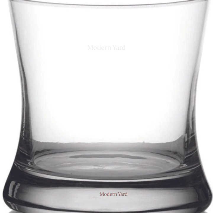 Designer crystal rocks glass with sleek modern curves perfect for whiskey, scotch and cocktail presentation and Home Bar Setup
