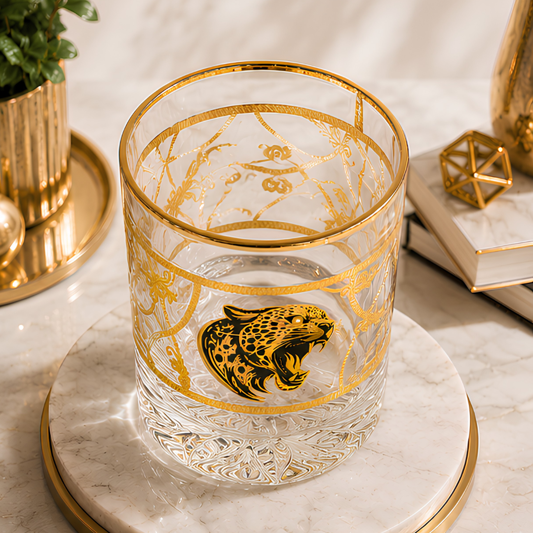 Premium Italian crystal whiskey glass featuring a luxury gold jaguar emblem