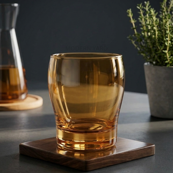 Elegant honey gold crystal drinking glass with minimalist contemporary styling