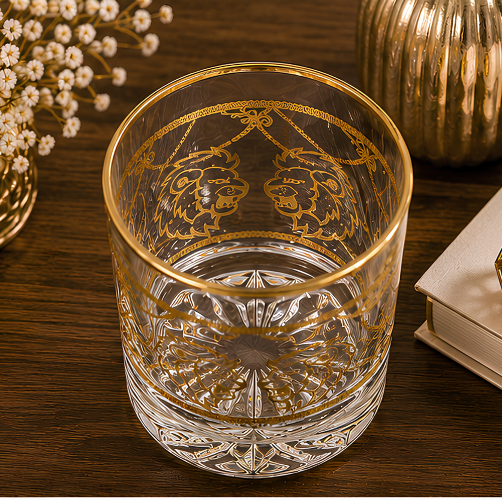 Elegant whiskey tumbler with thick crystal base and gold lion detailing
