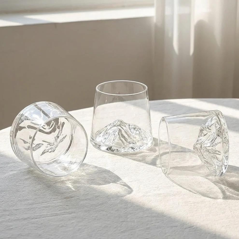 Modern Yard designer whiskey glasses with sculpted mountain base for elegant serving.
