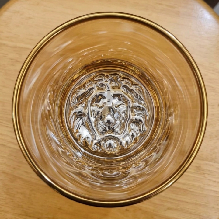 Close-up of gold lion design on Royal Leaf luxury whiskey glass