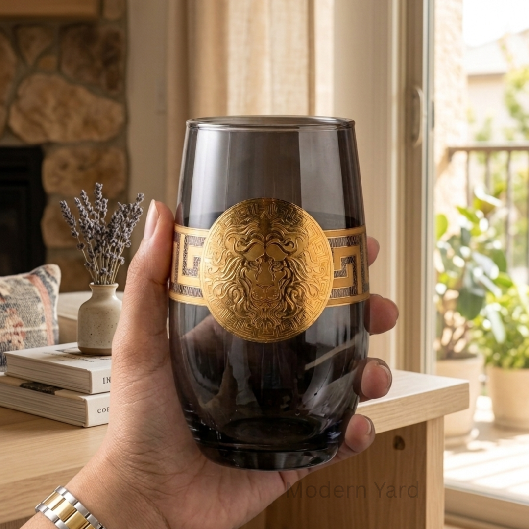 Luxury whiskey glass featuring gold lion crest and smoked finish