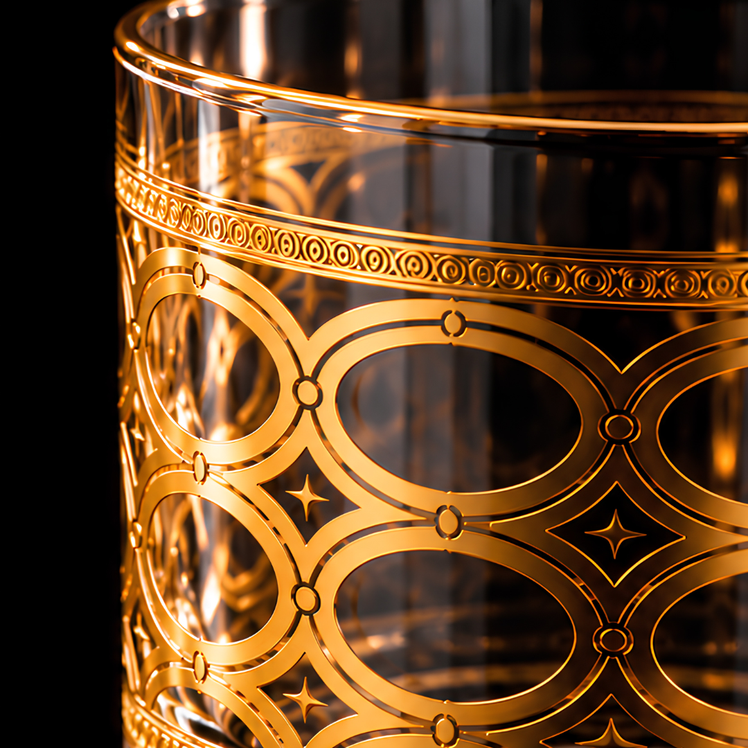 Close-up of the intricate gold oval pattern on the Aurelia luxury whiskey glass
