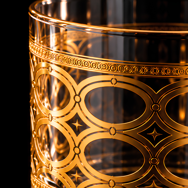 Close-up of the intricate gold oval pattern on the Aurelia luxury whiskey glass