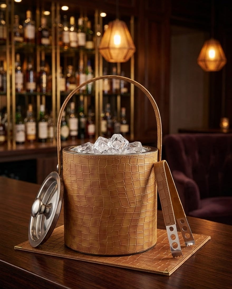 Front view of Modern Yard leather coated stainless steel ice bucket with tong